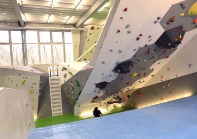huge roof indoor bouldering gym people climber